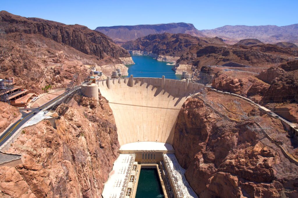 An aerial shot of the Hoover Dam, highlighting its impressive structure and surroundings — day trips from Las Vegas