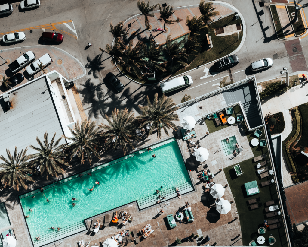 An aerial view of a popular Vegas pool party with people dancing and sunbathing. — Las Vegas pool parties
