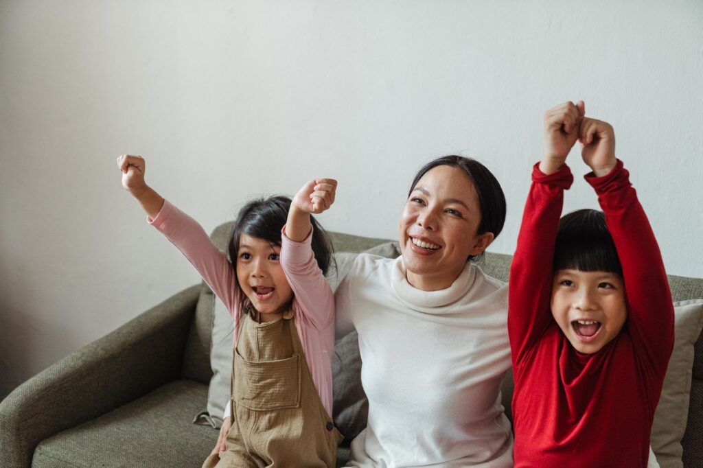 An image of a family enjoying a show with happy expressions. — discount show tickets Las Vegas