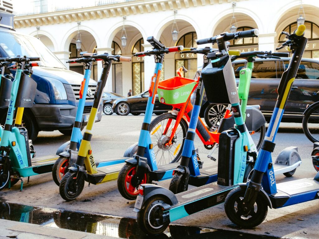 People using e-scooters on the Strip, demonstrating a popular alternative transportation method. — transportation in Las…