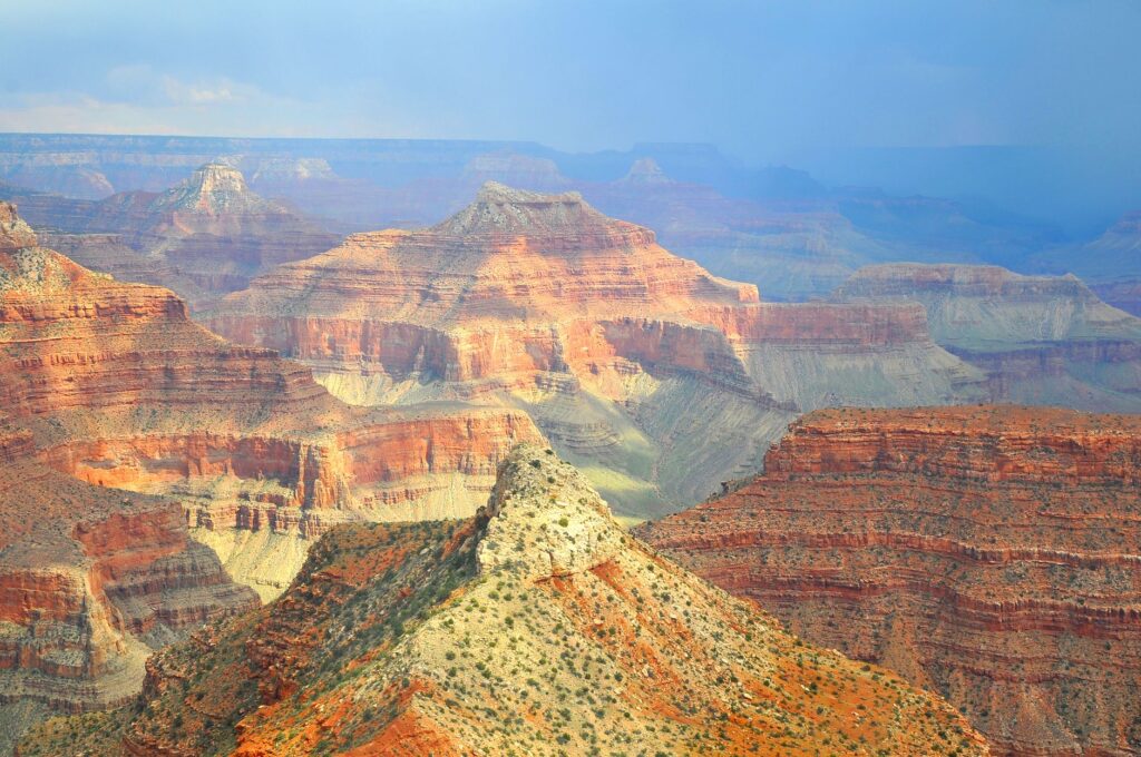 Stunning view of the Grand Canyon at sunset, showcasing its vastness. — day trips from Las Vegas