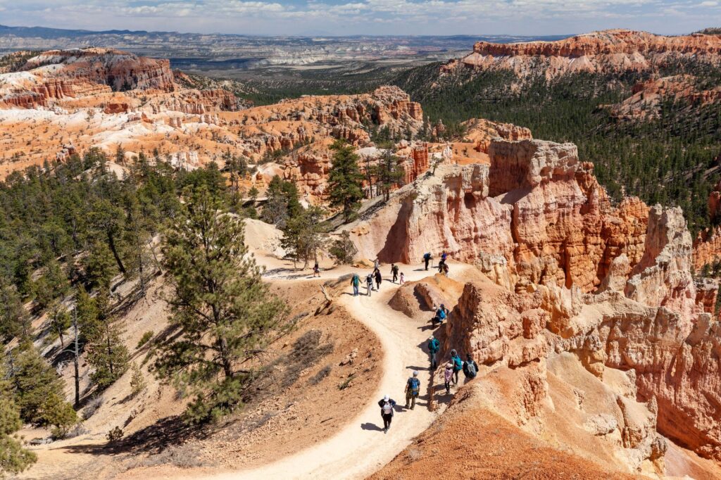 Tourists hiking the trails in Red Rock Canyon, capturing the essence of adventure and exploration. — Las Vegas day trips