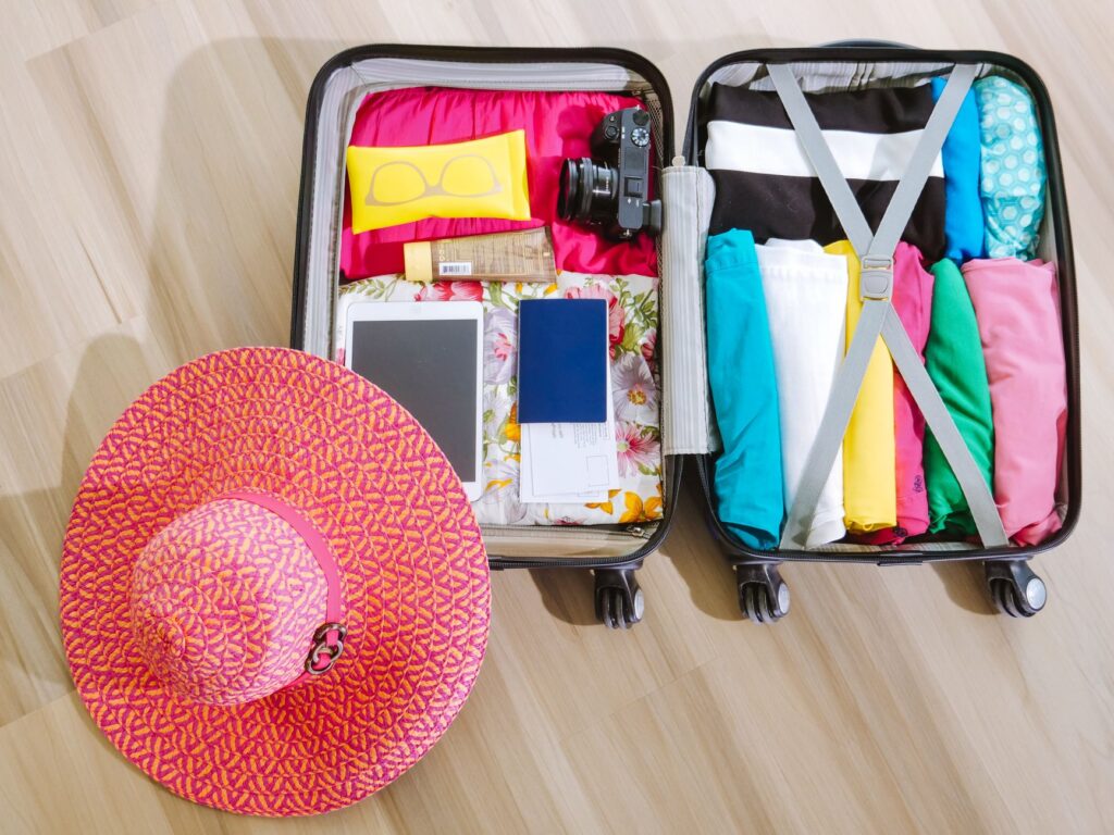 Travel essentials and a suitcase packed for a Las Vegas trip. — best time to visit Las Vegas